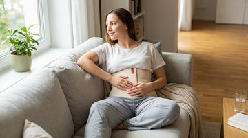 Woman wearing ORTONYX abdominal binder during bariatric surgery recovery at home