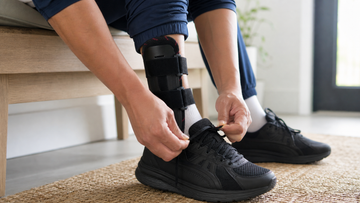 Adult comparing an ORTONYX ankle stabilizer brace and compression sleeve before a walk