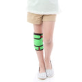 Child wearing ORTONYX Kids Knee Brace ACJB2102, green pediatric knee support with adjustable hook-and-loop straps