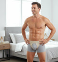 Man wearing bilateral inguinal truss hernia belt with adjustable straps and twin anatomically shaped groin pads.