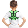 Back view of child wearing green pediatric figure‑8 clavicle support brace with padded straps; breathable posture corrector