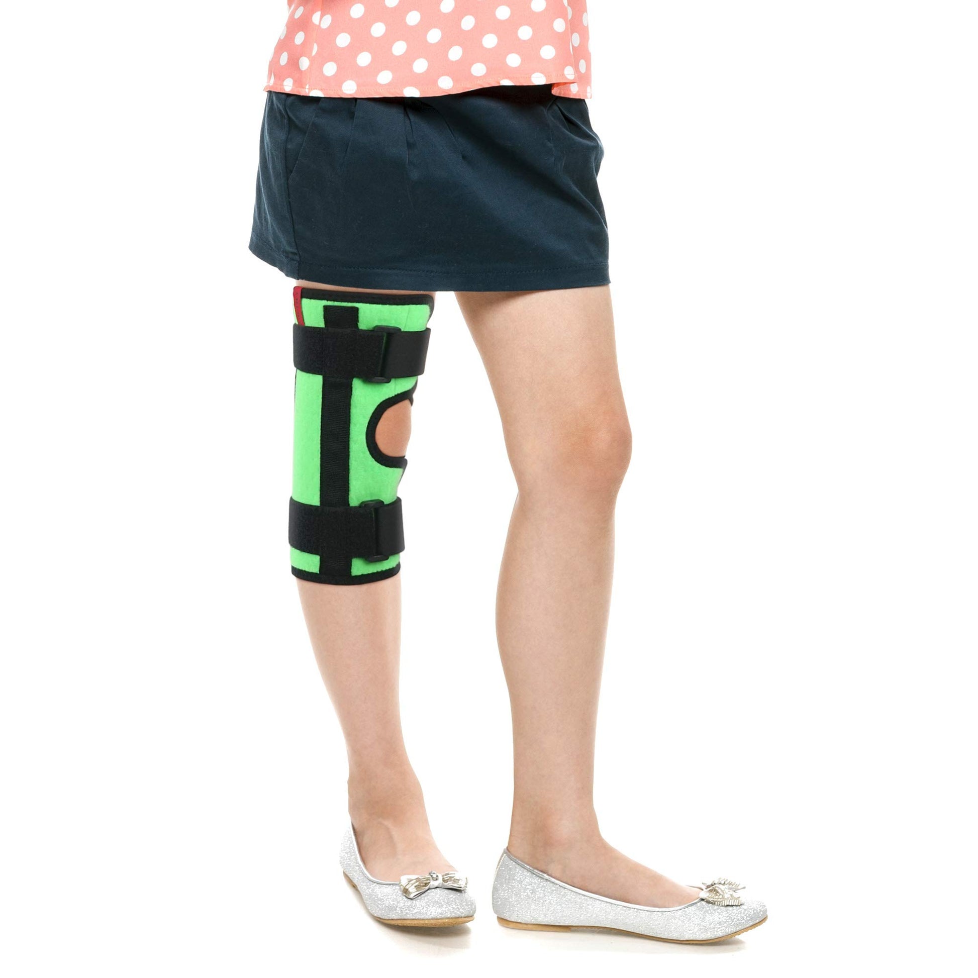 Child wearing ORTONYX Kids Tri-Panel Knee Immobilizer ACJB2117GR, green wrap with open patella and hook-and-loop straps
