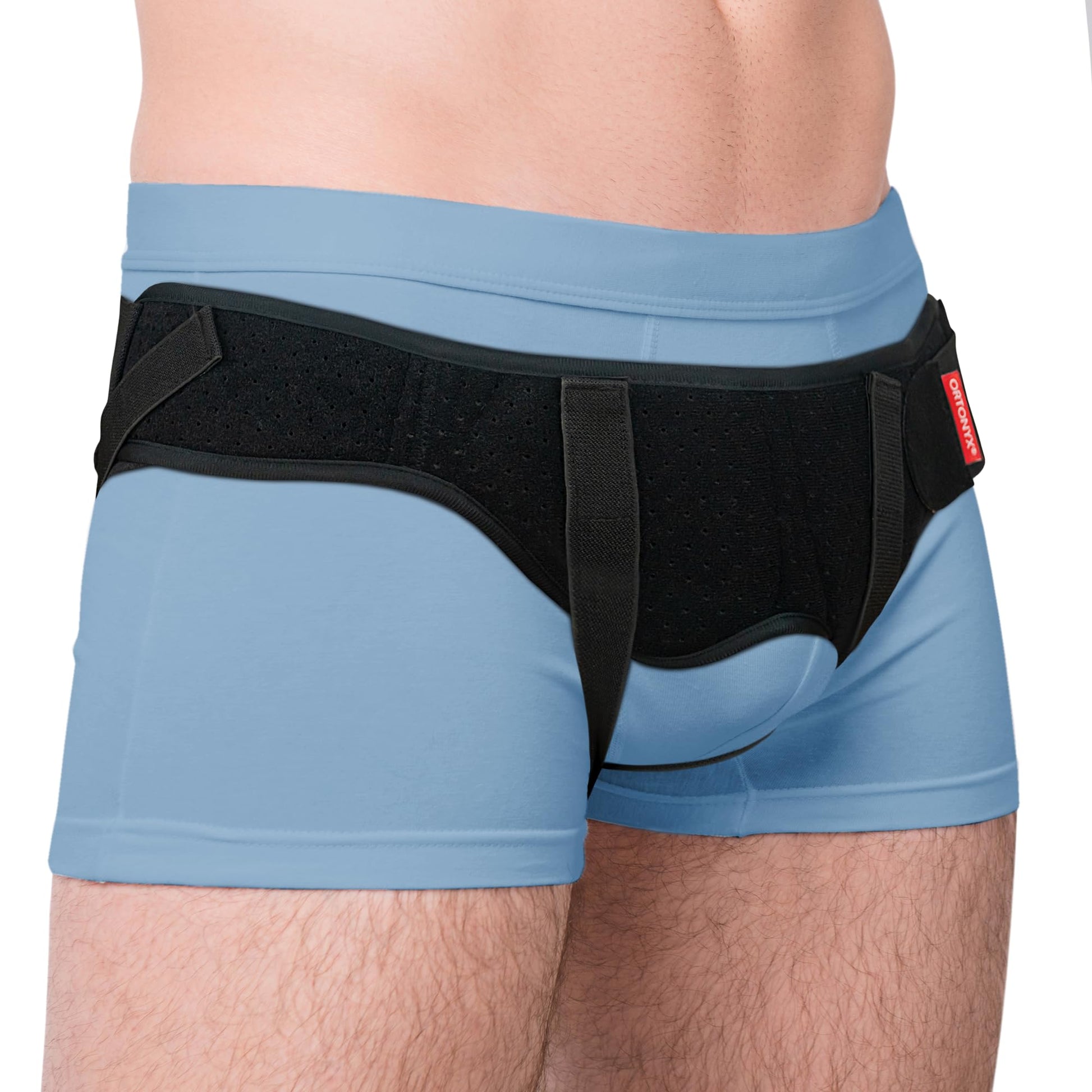 ORTONYX inguinal hernia belt truss over briefs, perforated mesh brace with dual pads and adjustable hook-and-loop straps.