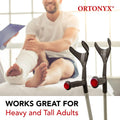 ORTONYX forearm crutches AL01, open cuff with red handle reflectors; aluminum pair beside adult with leg cast in clinic