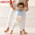 Baby wearing ORTONYX OX350 umbilical hernia belt with foam pad and hook-and-loop closure; pediatric hernia truss over navel