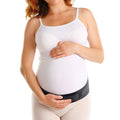 Model wearing ORTONYX pregnancy brace maternity support belt under abdomen; hook-and-loop closure for pelvic, lumbar support