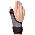 Hand in ORTONYX thumb immobilizer brace, spica splint with breathable knit and hook-and-loop straps leaving fingers free.