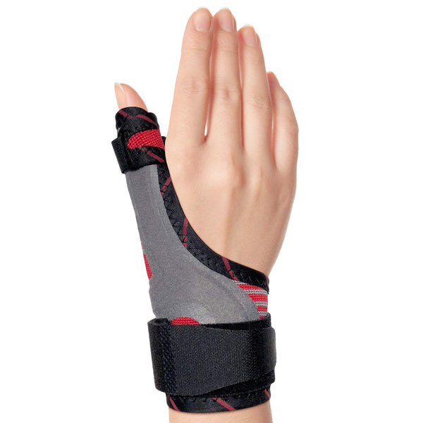 Hand in ORTONYX thumb immobilizer brace, spica splint with breathable knit and hook-and-loop straps leaving fingers free.