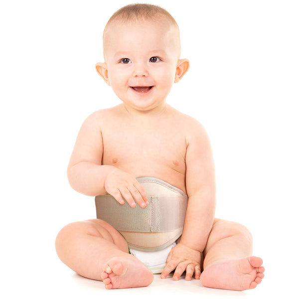 Baby wearing ORTONYX Baby Umbilical Hernia Belt OX350, beige infant hernia truss with foam pad and hook-and-loop closure