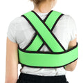 Child wearing neon green kids arm sling shoulder immobilizer brace with cross-back straps and swathe, ORTONYX ACJB2409.