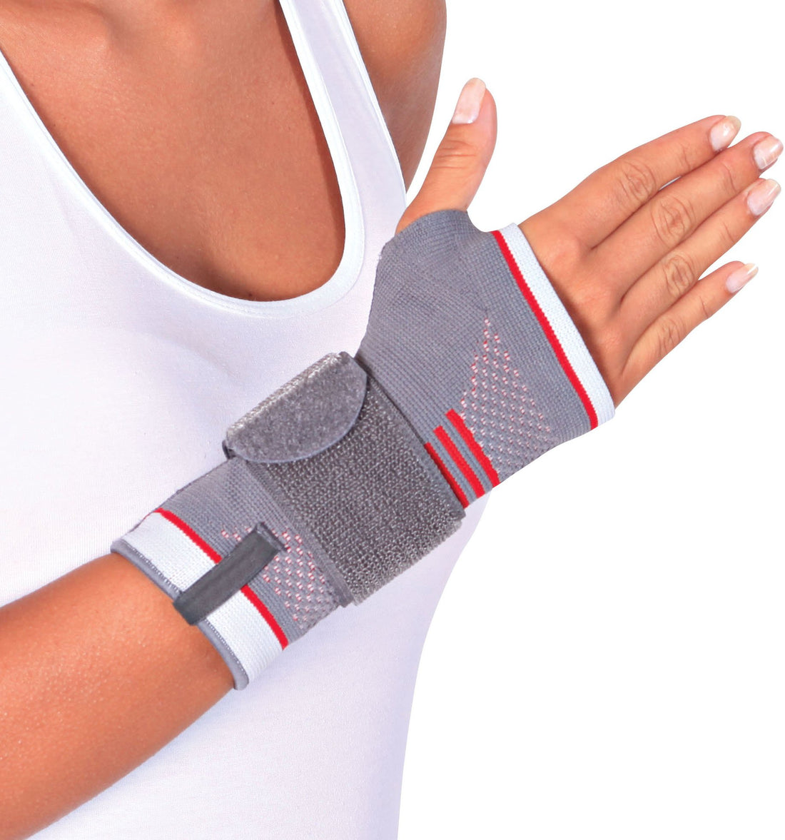 Hand wearing ORTONYX wrist brace, breathable knit compression with palmar pad and adjustable strap for carpal tunnel support.