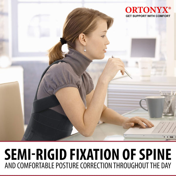 Woman working at laptop wearing ORTONYX 656 Comfort Posture Corrector, semi-rigid clavicle and shoulder support back brace.