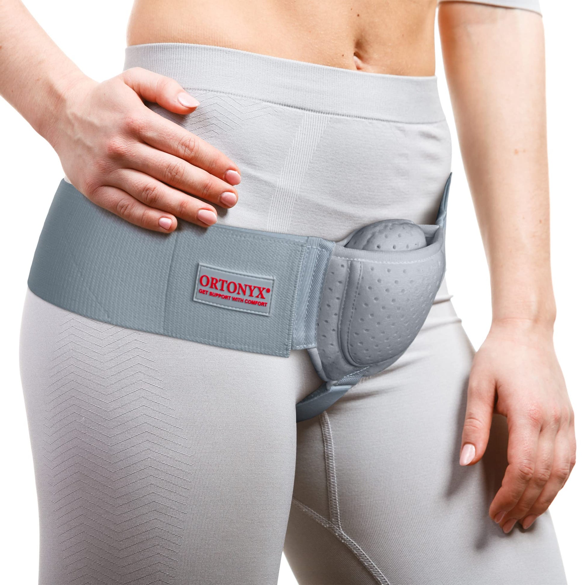 ORTONYX Inguinal Hernia Belt worn with right‑side anatomical compression pad, groin strap, and adjustable hook‑and‑loop waist