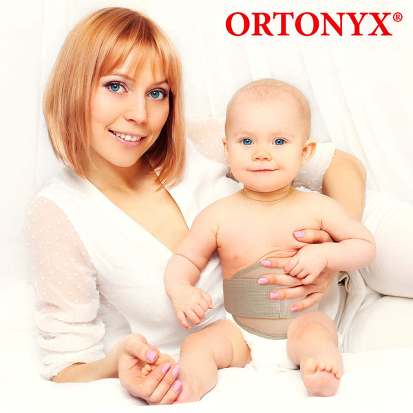 Baby wearing ORTONYX OX350 infant umbilical hernia belt, beige elastic truss with hook-and-loop closure; caregiver holding
