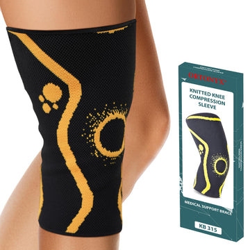 ORTONYX 3D knitted knee compression sleeve on leg, black with yellow patella ring meniscus support; brace shown with box