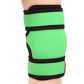 ORTONYX Kids Knee Brace ACJB2102 on child’s leg—green sleeve with elastic compression and hook‑and‑loop adjustable straps.