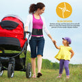 Woman outdoors wearing umbilical hernia belt abdominal support binder; slim hernia truss while pushing stroller