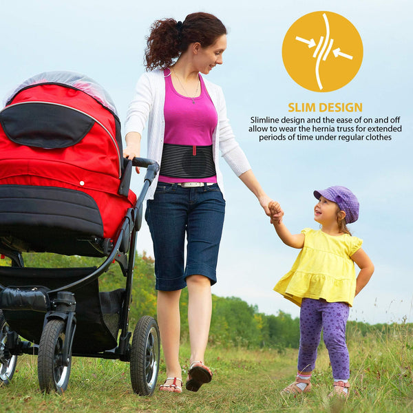 Woman outdoors wearing umbilical hernia belt abdominal support binder; slim hernia truss while pushing stroller