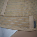 Beige ORTONYX Abdominal Binder on waist, Velcro-adjustable compression, breathable elastic mesh, tapered contour support belt