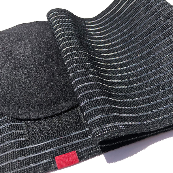 Umbilical hernia belt with removable concave silicone pad, elastic striped abdominal binder fabric, hook-and-loop closure